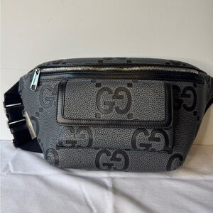 Gucci Medium Jumbo GG Belt Bag in grey and black grainy leather. 